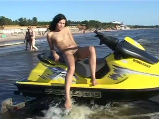 Watch the tits in the water from this nudist teen